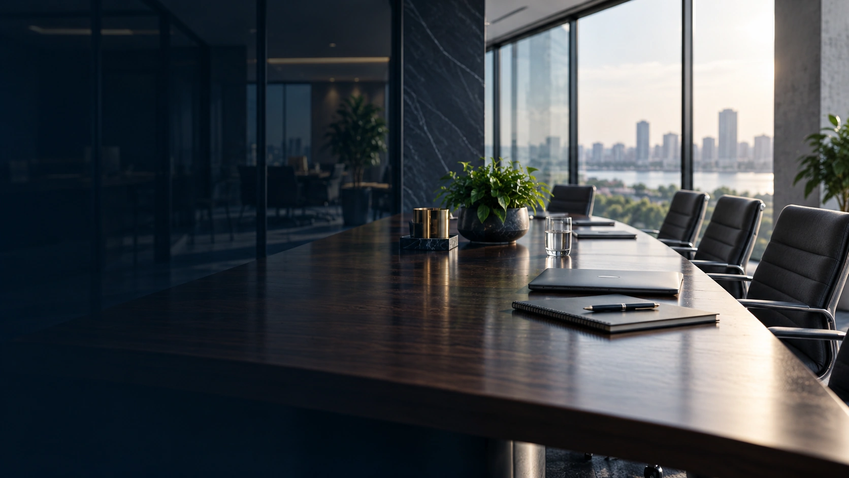 A contemporary conference room with a table, chairs, and natural light.